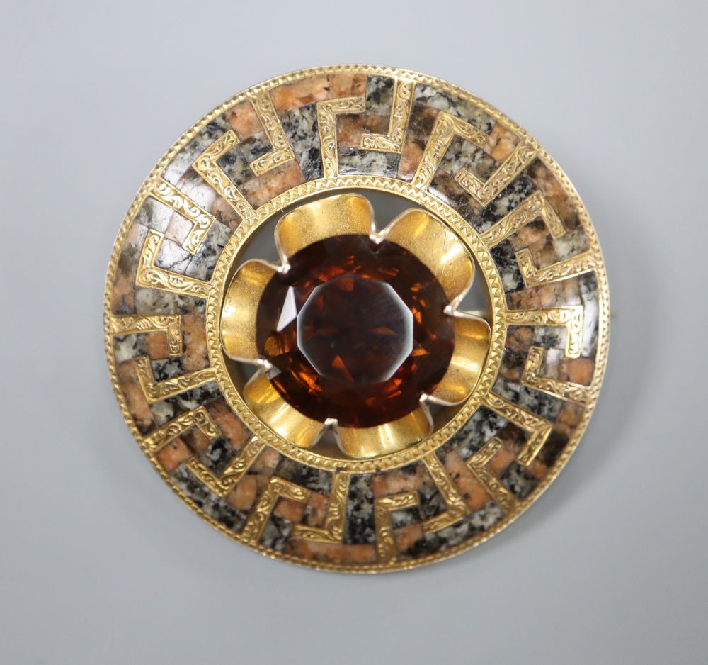 A Victorian yellow metal, citrine and Scottish hardstone set circular brooch, 48mm, gross 32.6 grams.